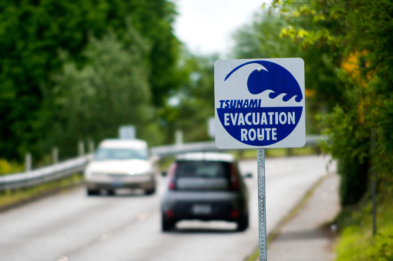 Vehicles travel on West Second Street in Port Angeles along a tsunami evacuation route Tuesday. (Jesse Major/Peninsula Daily News)