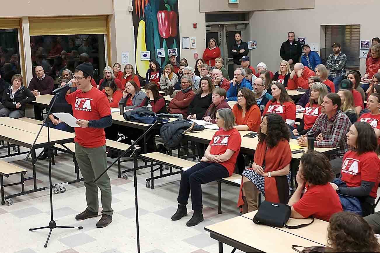 At last week’s meeting, educators, most dressed in red — the color now synonymous with supporting public school teachers — spoke about the potential reductions. Susan Riemer/Staff photo