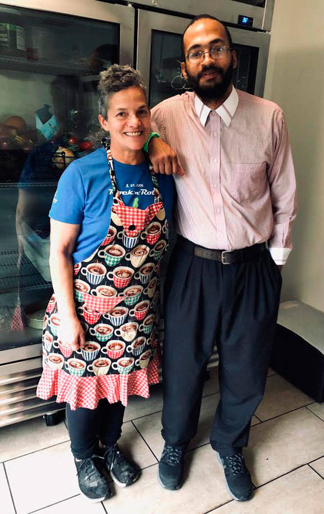 Michaella Olavarri, left and her son, Mark Dunham, pose for a portrait inside their new business, Mica’s Kitchen, on Monday, Oct. 7 (Kate Dowling/Staff Photo).