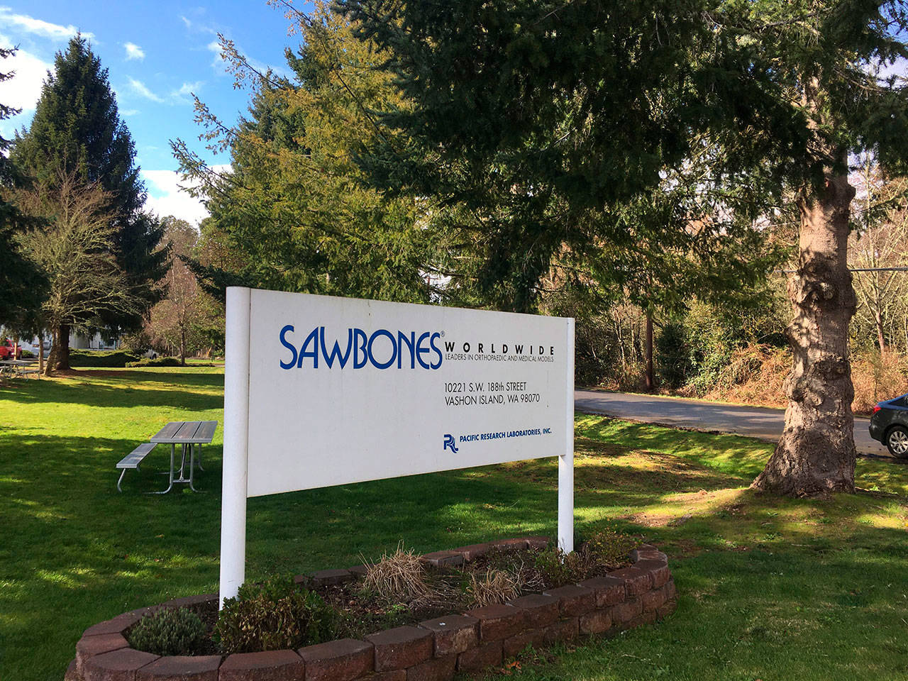 The sign for Sawbones, a subsidiary of Pacific Research Laboratories, is pictured at the company’s island headquarters on Wednesday, March 11 (Liz Shepherd/Staff Photo).