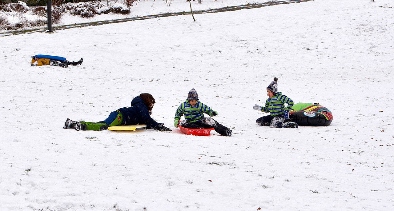 (Jenna Dennison Photo) Children took to the hill in Ober Park to get some sledding in on Monday afternoon, Dec. 27.