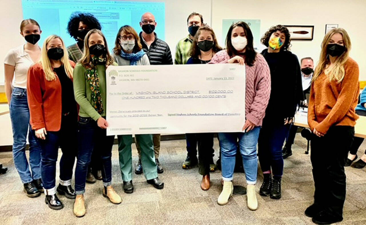 (Photo Courtesy Donna Nespor) The Vashon Schools Foundation presented a check for $102,000 to the VISD board during their meeting on Thursday, Jan. 13.