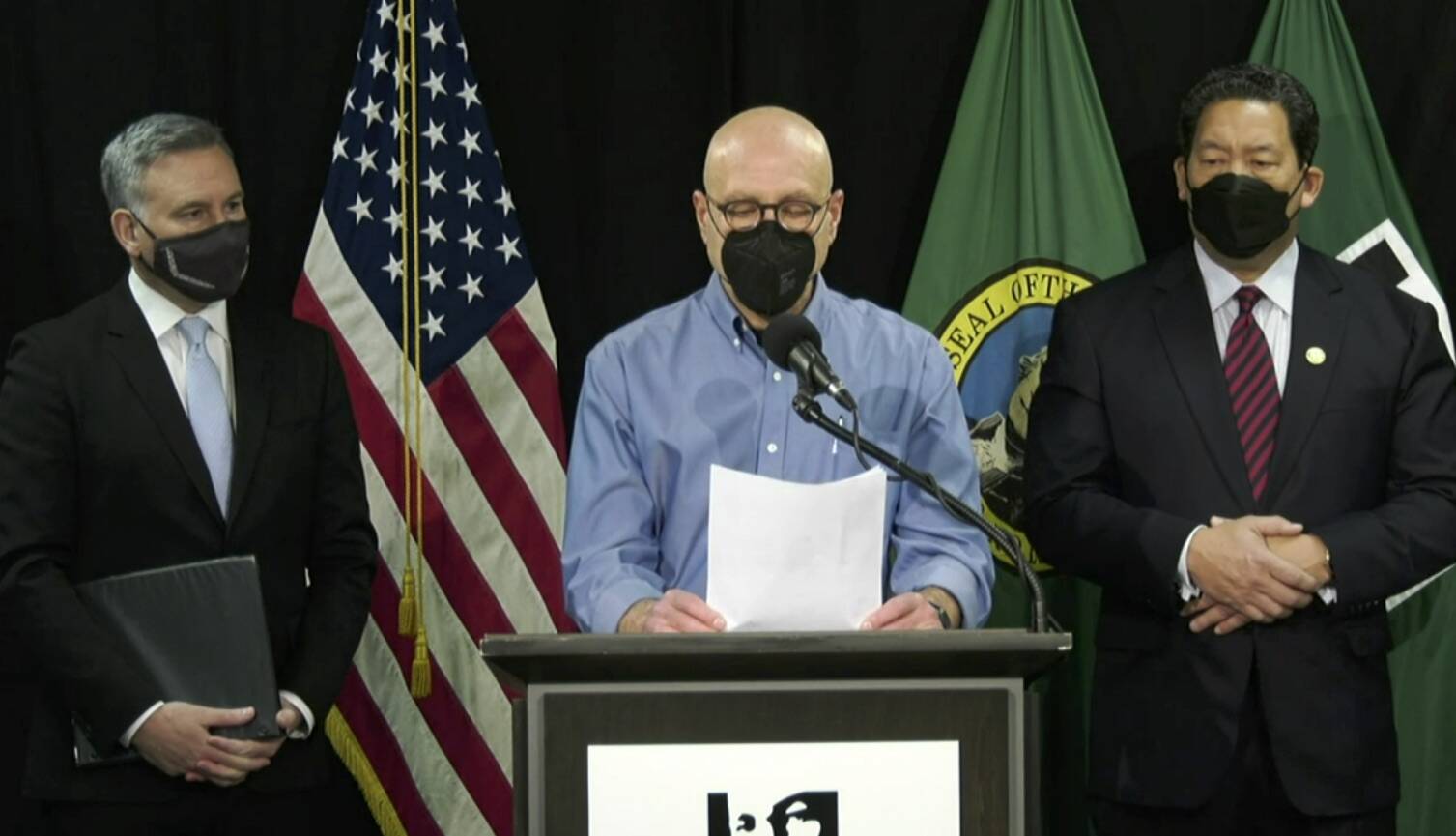 Public Health Officer Jeff Duchin (center), joined by King County Executive Dow Constantine (left) and Seattle Mayor Bruce Harrell announced, the county’s decision to lift the vaccination verification requirement for King County businesses beginning on Mar. 1, 2022. The announcement was made during a press briefing on Wednesday, Feb. 16. (Screenshot)