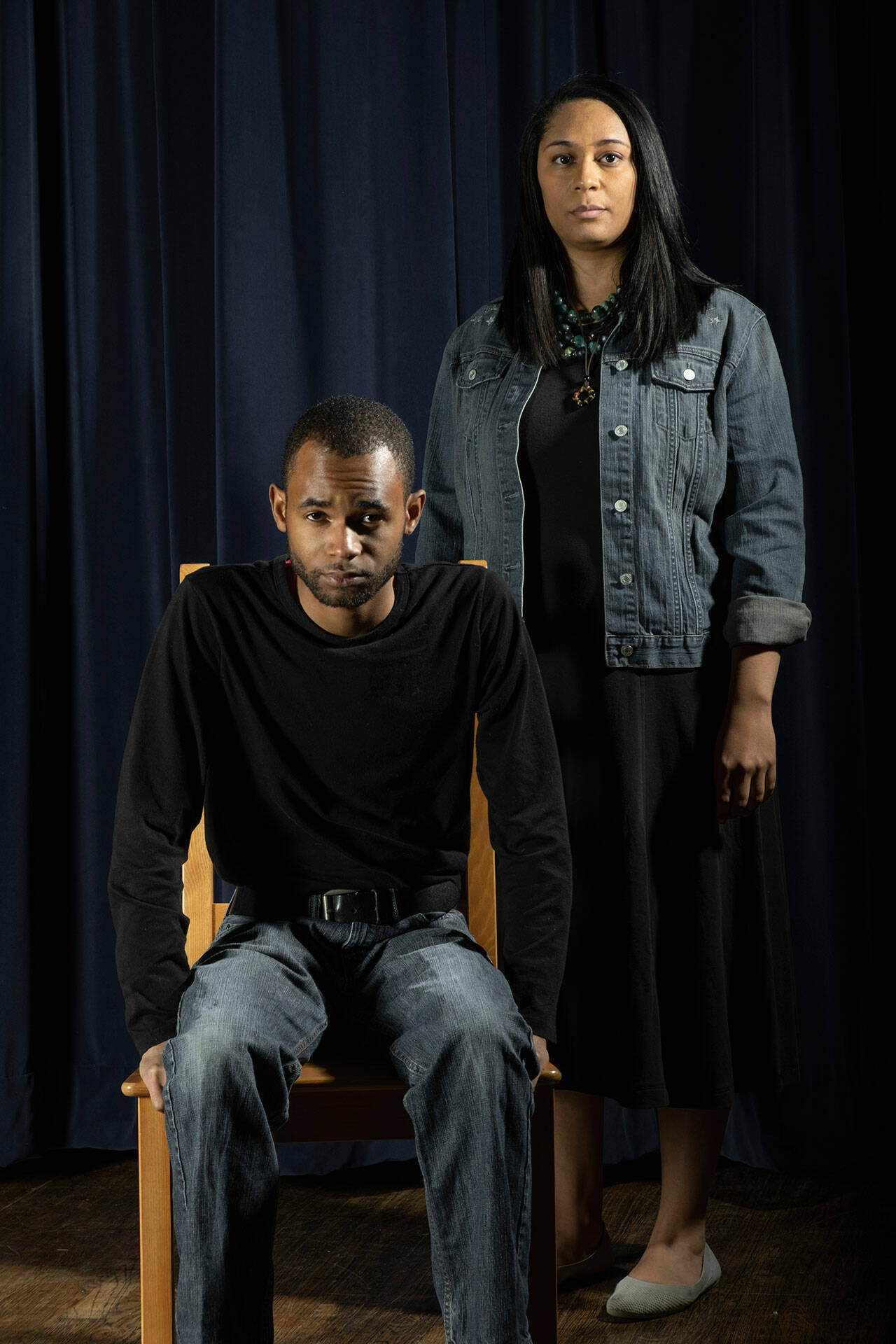 (Michelle Bates Photo) Rowin Breaux (seated) plays exoneree David Keaton who spent three years on death row for a crime he didn’t commit. Keaton became the first person in the United States to be exonerated from death row, but remained in prison another six years. Alma Davenport (standing) portrays Georgia Hayes, who after spending six years on death row was exonerated and released based on recovered evidence of original records of the crime.