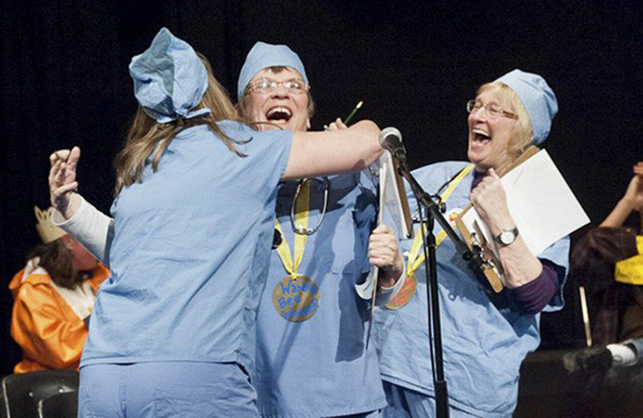 (File Photo) Sharon Boyer, among many other accomplishments, was a fierce competitor at local spelling bees. With The Wanna Bees, a team comprised of Ann Murray, Boyer (center) and Cheryl Pruett, Boyer clinched the championship in the 2012 Vashon Community Scholarship Foundation spelling bee, when she correctly spelled the word “ichneumon” (ik-noo-muhn), which means — appropriately enough at a spelling bee — a “wasp-like insect.”