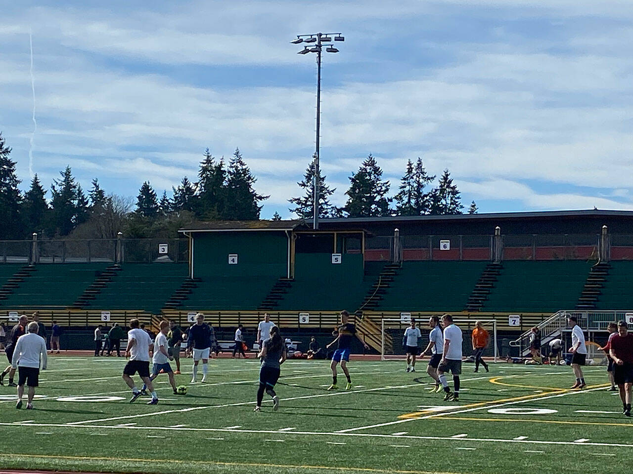 (Tom Hughes Photo) An adult soccer league out playing on the VHS field used for football, soccer, and other sports.