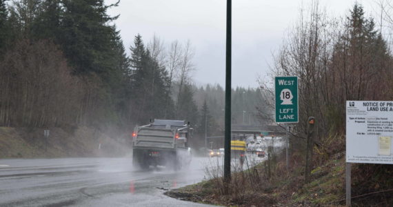 A State Route 18 sign in Snoqualmie before the SR 18/I-90 interchange. File photo Conor Wilson/Valley Record.