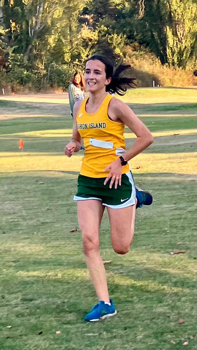 Hannah Coicaud sprints to the finish line in Port Townsend (Roger Fick Photo).