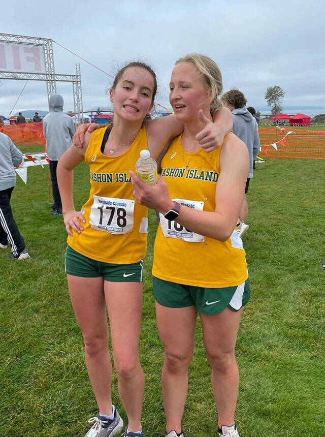 Cecelia Guenther, left, and Madeline Yarkin, right, celebrate qualifying for the state championships after their District race on Oct. 29 (Photo courtesy of VHS Pirate Cross Country Coach Lisa Cyra).