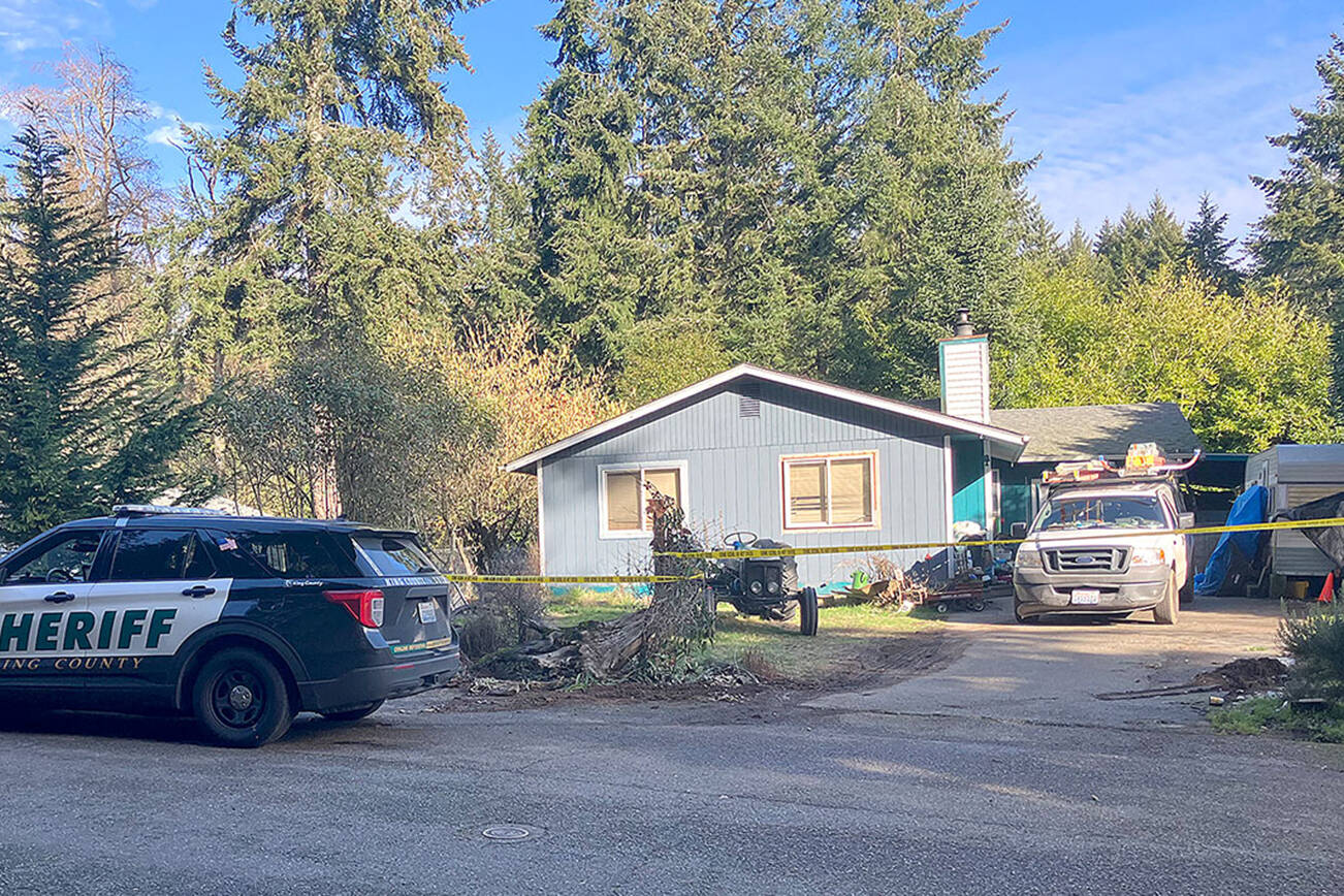 A house in Vashon’s Fir Ridge neighborhood, on the block where deputies say the crime took place, was sealed off with crime tape on Thursday afternoon. (Elizabeth Shepherd Photo)