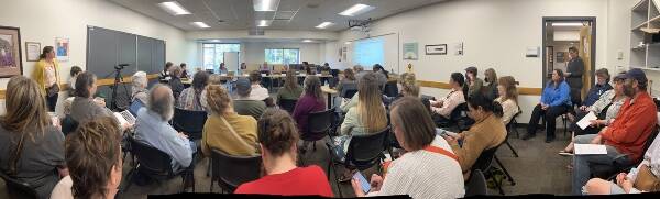 A standing-room-only audience filled the district’s small conference room at an April 27 school board meeting (Elizabeth Shepherd photo).