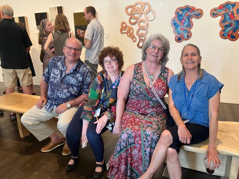 (Left to right) Jon, Brette and Shannon Flora, joined by Barbara Dusty Gustafson, take in the scene on the opening night of VCA’s Summer Arts Fest, at Vashon Center for the Arts. Both Brette and Gustafson are local artists, with work in the first round of shows for the annual festival (Elizabeth Shepherd Photo).