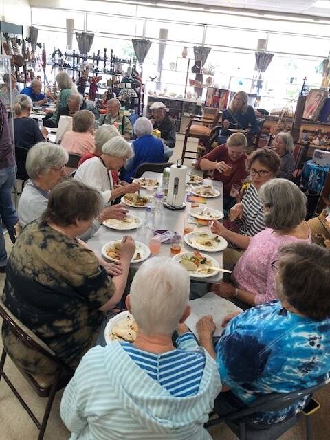 Granny’s Attic volunteers and staff enjoyed a feast from Casa Bonita and Vashon Bakers inside the thrift store (Courtesy Photo).