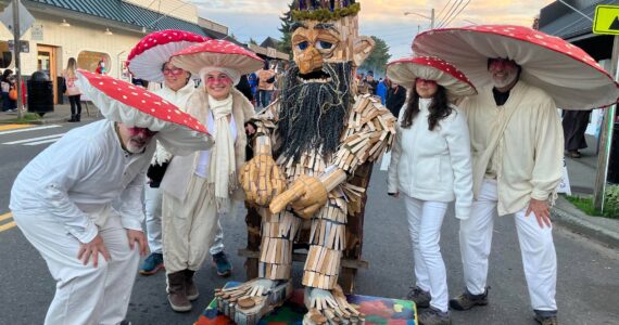 Matt Beursken, as Edgar the Forest King, surrounded by a group that calls itself “The Mushroom 5.” These fungi friends included (Left to right) Phil Levin, Amy Greenberg, Veronica Fernmoss, Elizabeth Braverman, and Brad Roter (Liz Shepherd Photo).