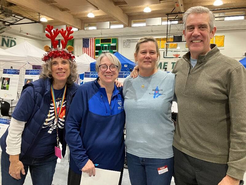 (Left to right) Suzanne Apodaca and Darla Varrenti, from the Nick of Time Foundation, with Jill and John Yates, of the Sam Yates Community Foundation, at Vashon High School (Elizabeth Shepherd Photo).