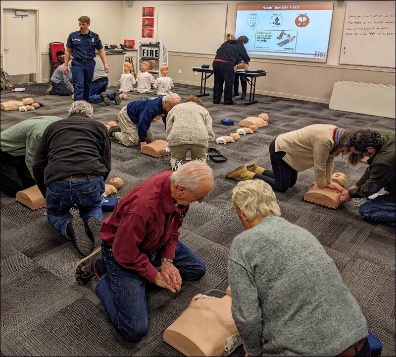 Vashon Emergency Operations Center’s (EOC) team walks the talk, always working on preparedness, including personal preparedness. At the March EOC Drill Night, team members received CPR/AED training from VIFR Lieutenant Ben Steele (top left) (Rick Wallace Photo).