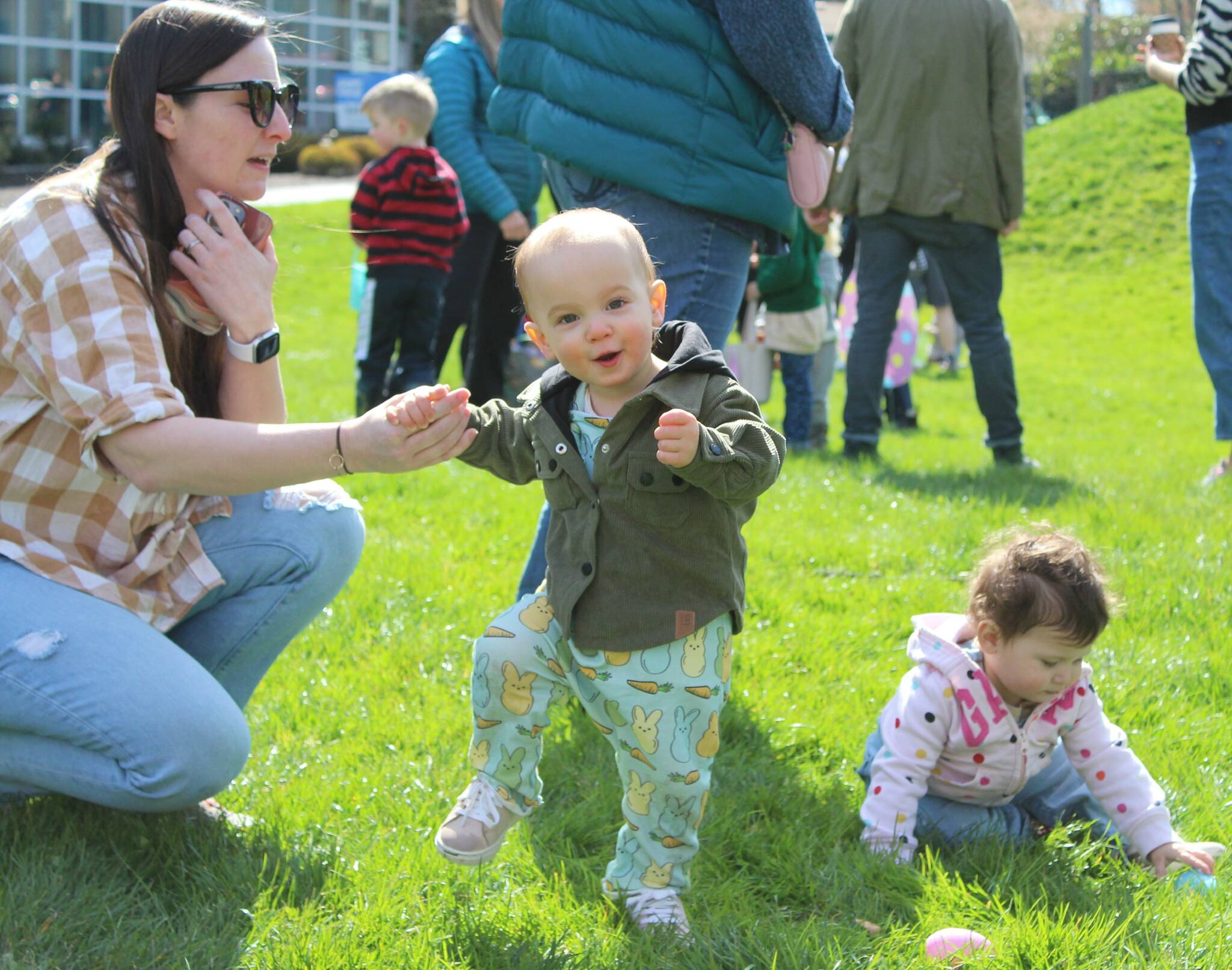 It’s all smiles for this carrot-and-bunny-jammies wearing kid after the annual Easter Egg hunt at Ober Park. Alex Bruell photo.