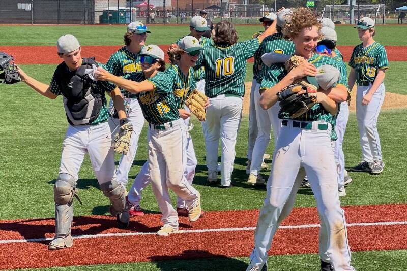 The Vashon Pirates celebrate raucously after a fastball from Will Frith and a catch by Jack Harvey seals their ticket to the 1A State Baseball Tournament (Connon Price Photo).