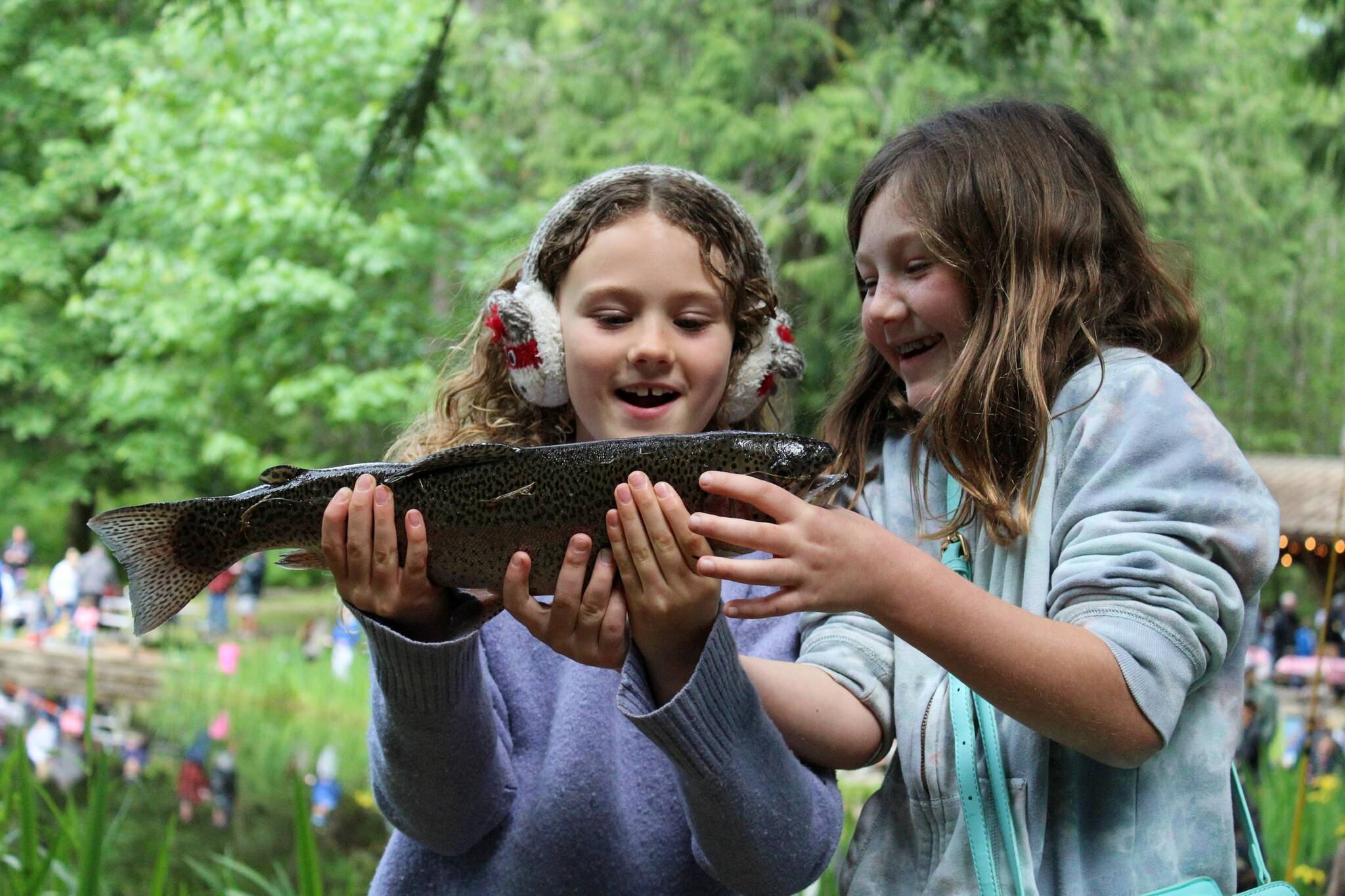 Alex Bruell photo
Gwendolyn Rose, 8 (left) and Joss Moe, 8, marvel at the trout that Gwendolyn caught and Joss reeled in.