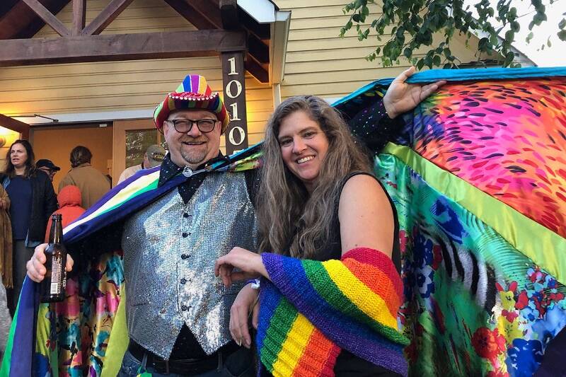 Matt Beurksen and Jessica De Wire showed their pride at the opening of a 2019 Vashon Heritage Museum exhibit, “In and Out: Being LGBTQ on Vashon” (Tom Hughes Photo).