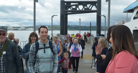 Wendy Aman photo
Passengers step off the King County Water Taxi serving Vashon and Seattle on June 27, during an inaugural sailing of the taxi’s expanded hours. The passenger-only vessel now runs in the middle of the day, not just mornings and evenings.