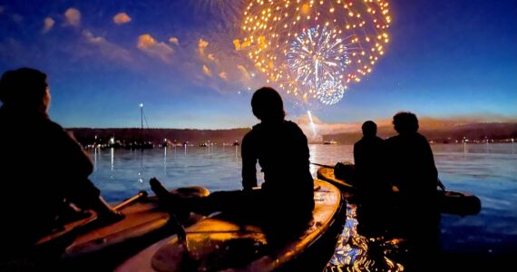Fireworks light up the sky on July Fourth as paddlers watch from inner Quartermaster Harbor. (Corinne Sherry photo.)