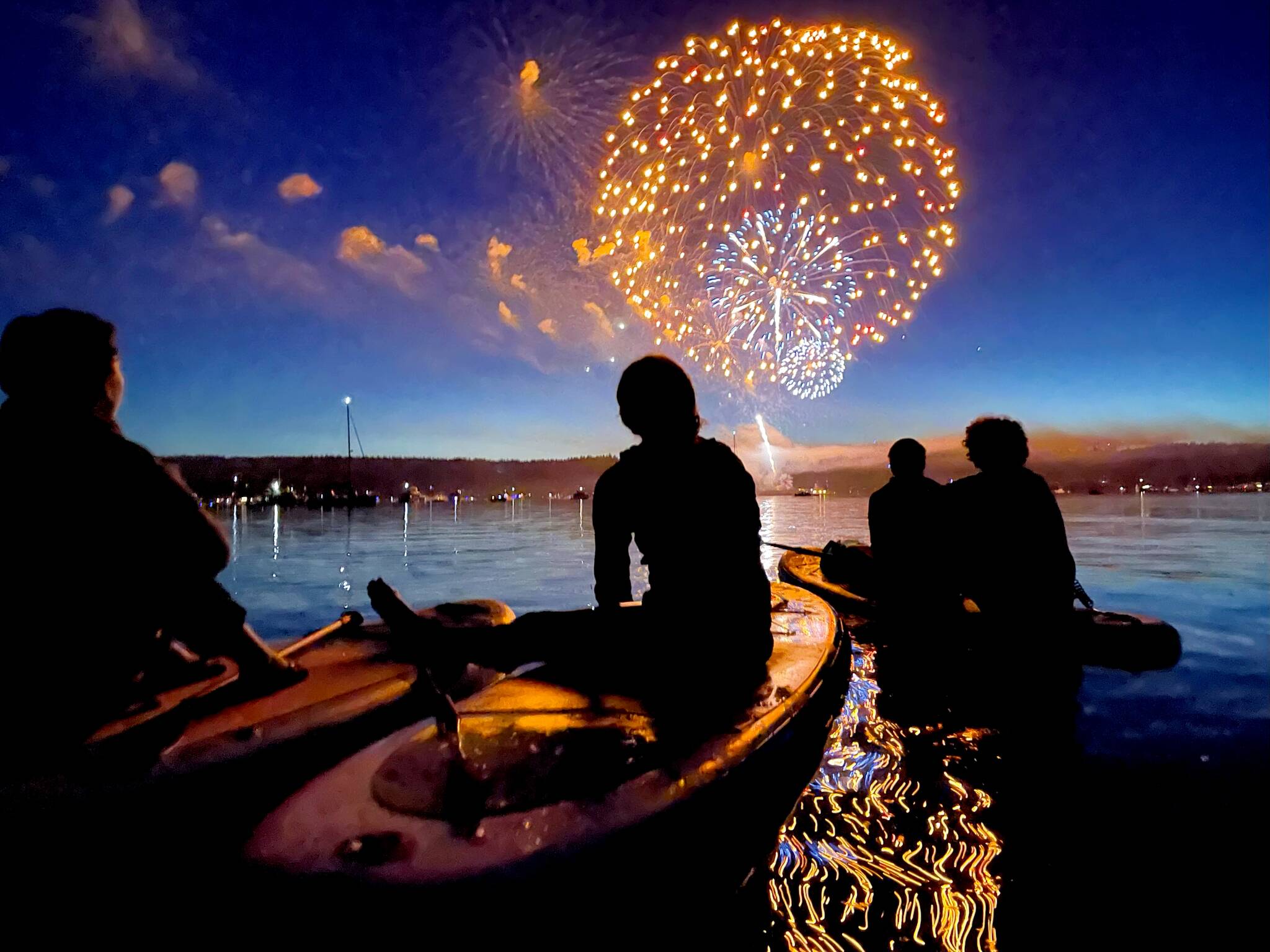 Fireworks light up the sky on July Fourth as paddlers watch from inner Quartermaster Harbor. (Corinne Sherry photo.)