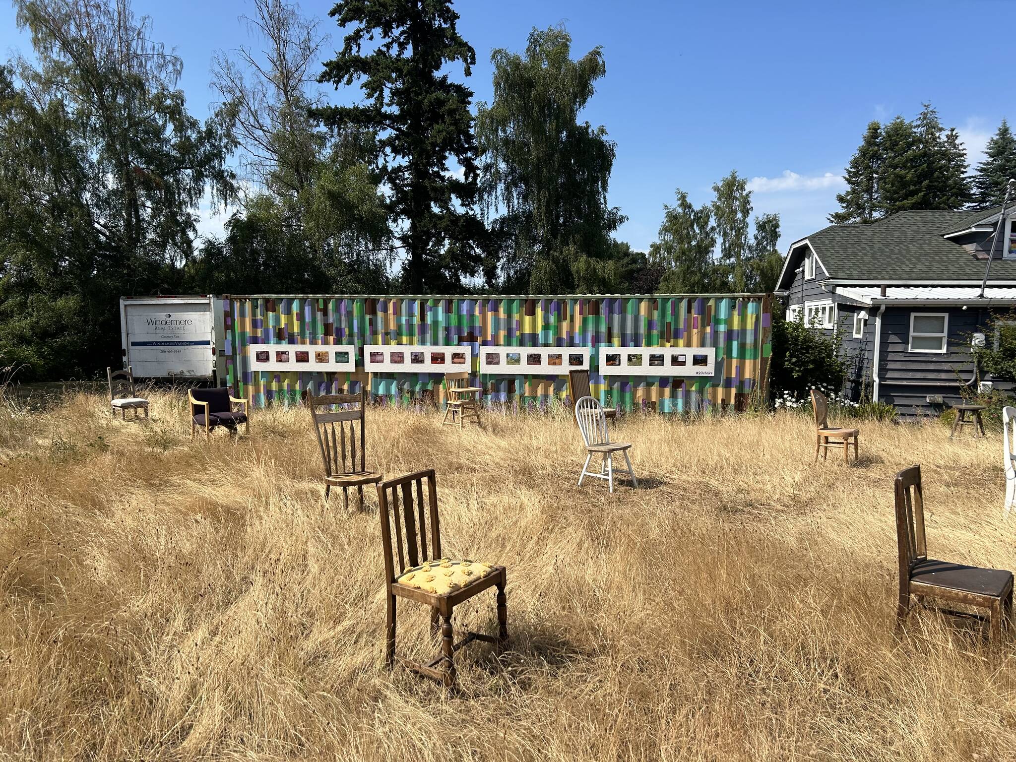 Twenty empty chairs, along with an interactive wall of graphics, now occupy a field just south of the DOVE Project’s office in the center of Vashon. (West McLean photo)