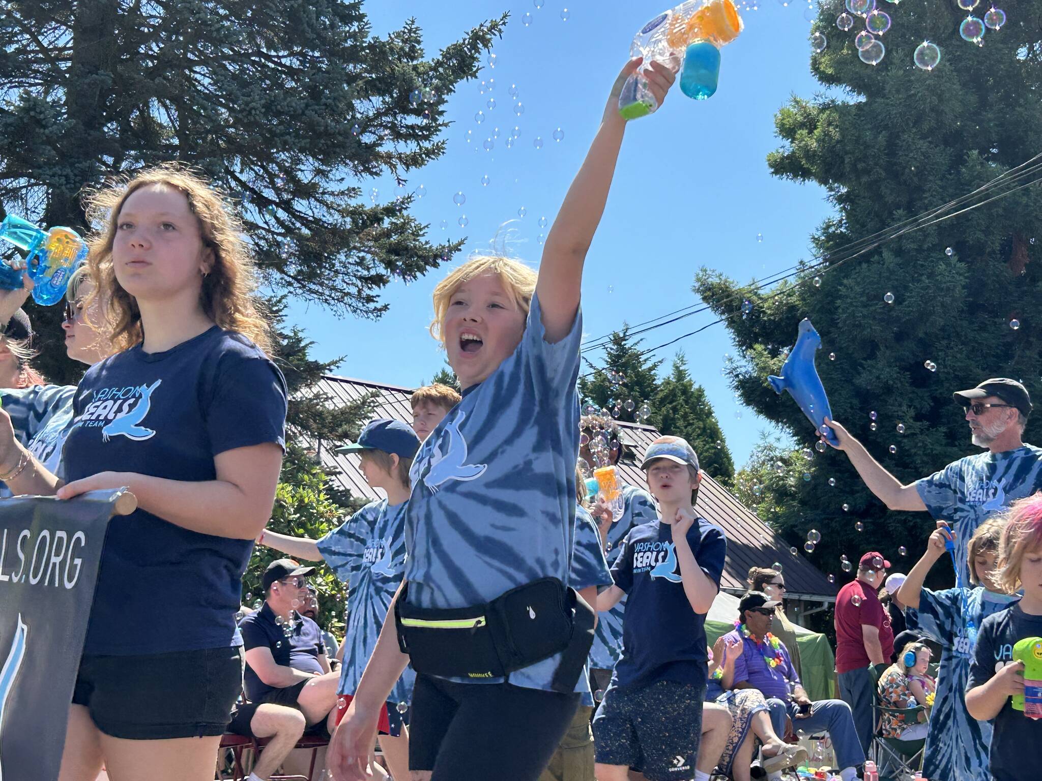 Vashon Seals, surrounded by soap bubbles, exuberantly marched down Vashon Highway during the parade. (Tom Hughes photo)