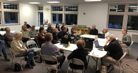 The Vashon Health Care District board (right) discusses a plan to bring urgent care to Vashon Island, with the Vashon Island Fire & Rescue board and members of the public in attendance.