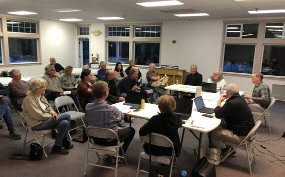 The Vashon Health Care District board (right) discusses a plan to bring urgent care to Vashon Island, with the Vashon Island Fire & Rescue board and members of the public in attendance.