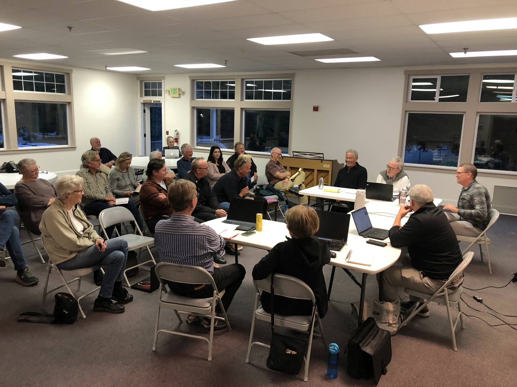 The Vashon Health Care District board (right) discusses a plan to bring urgent care to Vashon Island, with the Vashon Island Fire & Rescue board and members of the public in attendance. (Alex Bruell photo.)