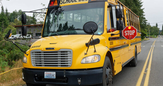 You must stop your vehicle when a school bus looks like this, even if you are in the opposing lane. The lights are flashing red, and the stop-sign arm is extended. (Rick Wallace photo.)