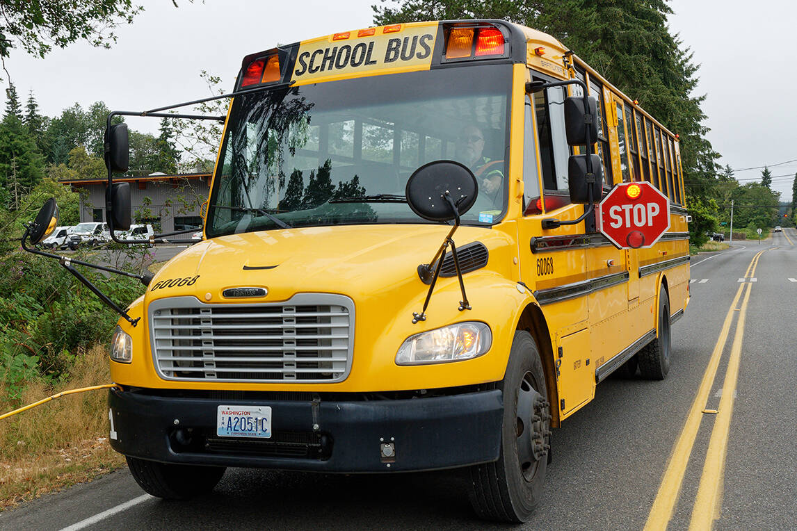 You must stop your vehicle when a school bus looks like this, even if you are in the opposing lane. The lights are flashing red, and the stop-sign arm is extended. (Rick Wallace photo.)