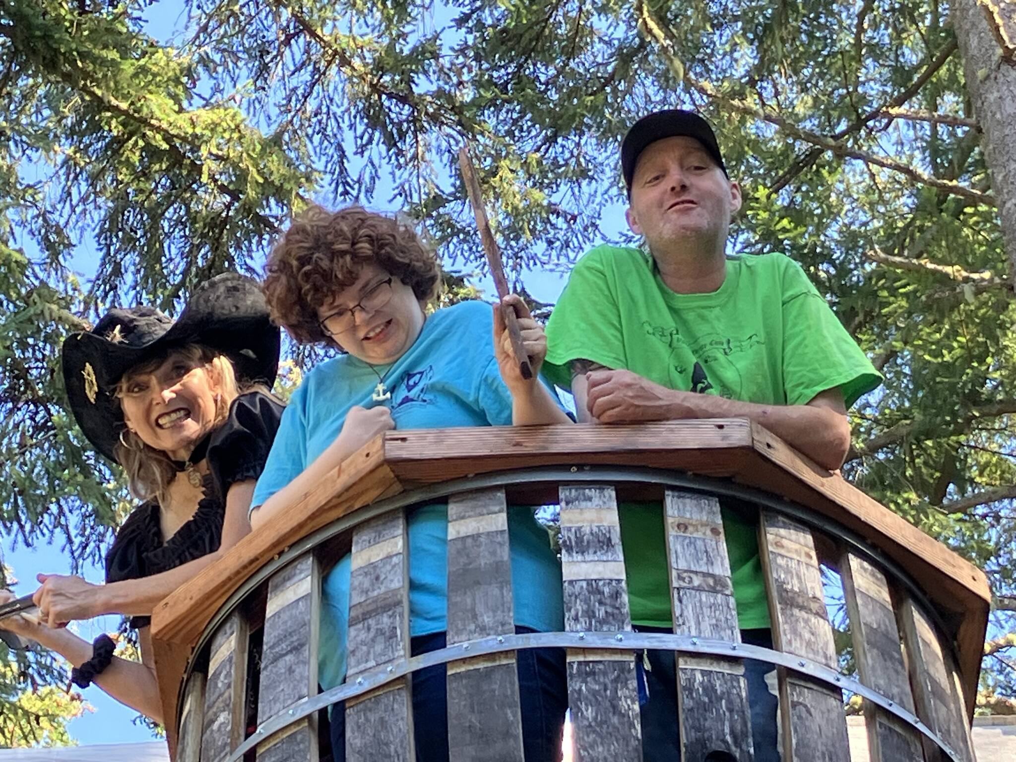 (Left to right) Meri-Michael Collins, Brette Flora and Dean Neilson say “argh” to the camera from the crow’s nest of the pirate ship at Vashon Pirate Camp. (Elizabeth Shepherd photo)