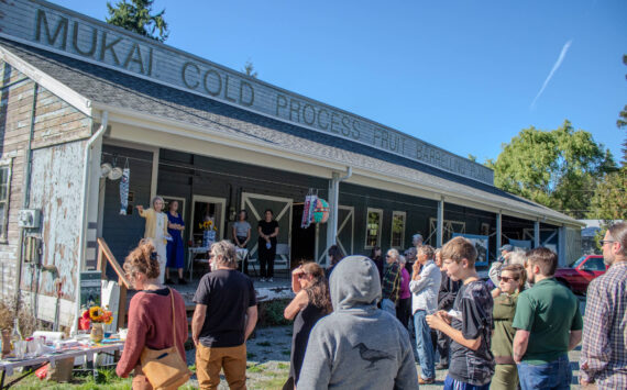 A large crowd gathered Sept. 18 at the Mukai Farm & Garden barreling plant to celebrate the transfer of the property to the Friends of Mukai. (Alex Bruell photo)