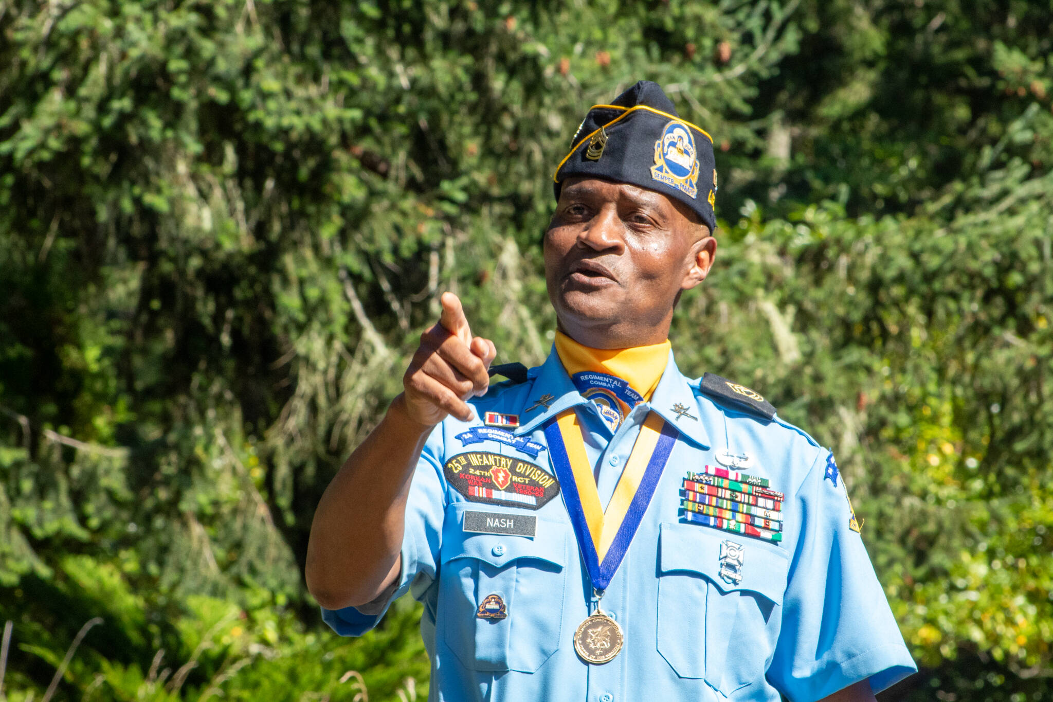 Veteran Darrel Nash, a board member of the Buffalo Soldier Museum in Tacoma, regales the audience with stories of Buffalo Soldier Benjamin Glover. (Alex Bruell photo)