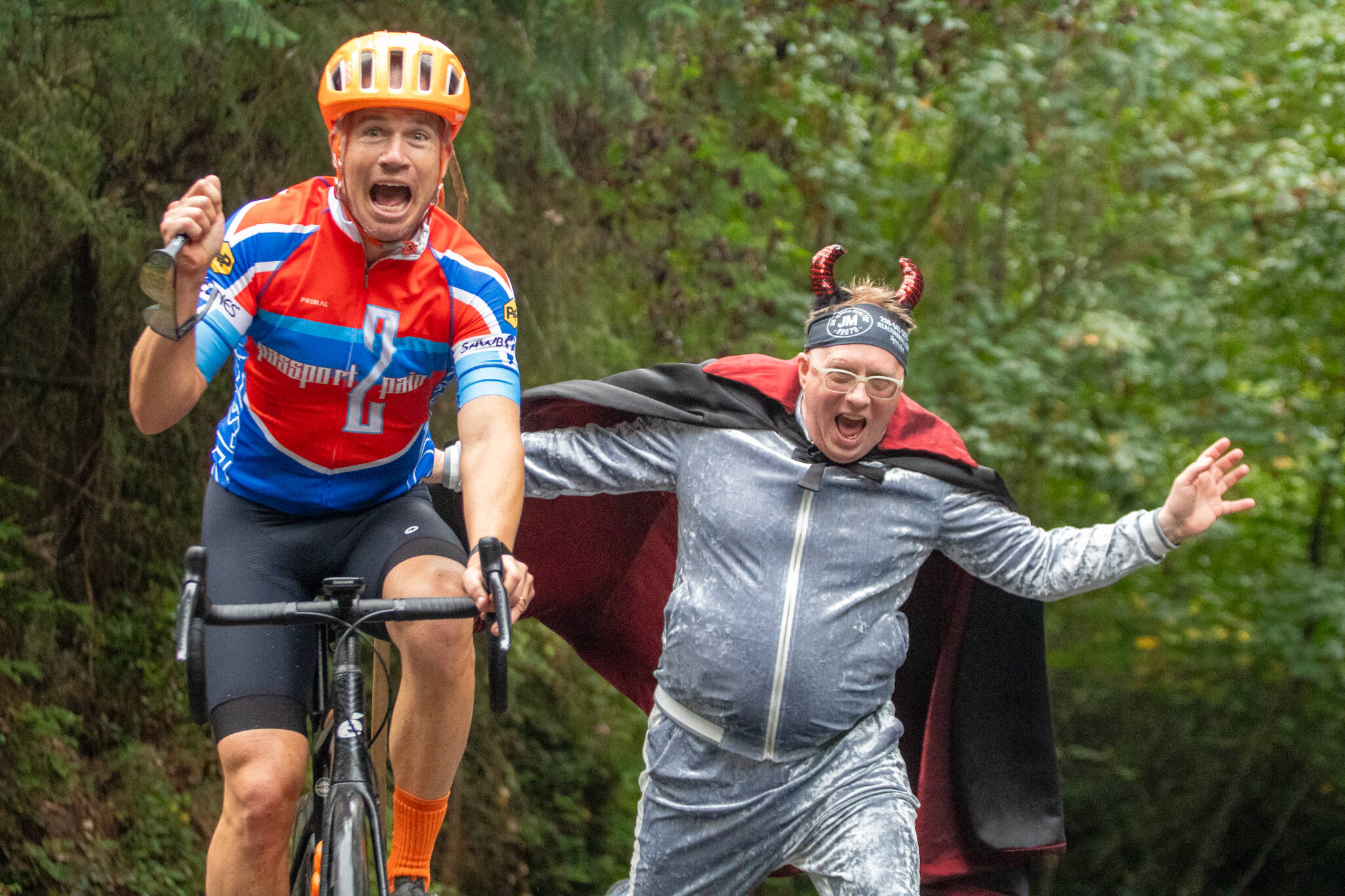 Jim Marsh “encourages” a rider during the Passport2Pain bike ride on Saturday, September 14. (Alex Bruell photo)