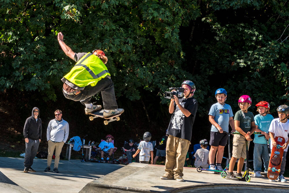 Younger scooterists studied the moves of older skateboarders at the “Pump the Bump” event. (Mike Dillmann photo)