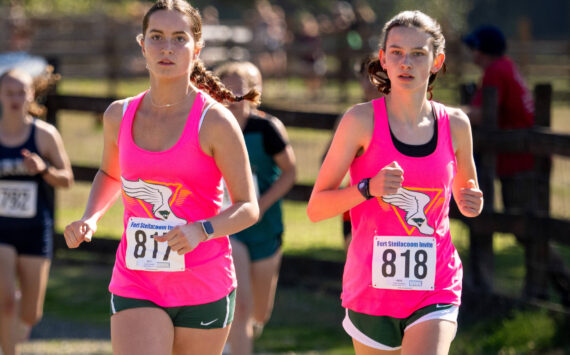 Co-captains Cece Guenther and Emily Harrington run at Fort Steilacoom, WA on Saturday, September 21. (John Decker photo)