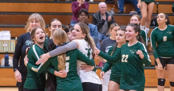 Alex Bruell photo
Vashon's volleyball players embrace after a rally in a game against East Jefferson High School at Vashon on September 25.