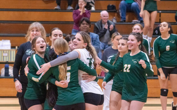 Alex Bruell photo
Vashon's volleyball players embrace after a rally in a game against East Jefferson High School at Vashon on September 25.