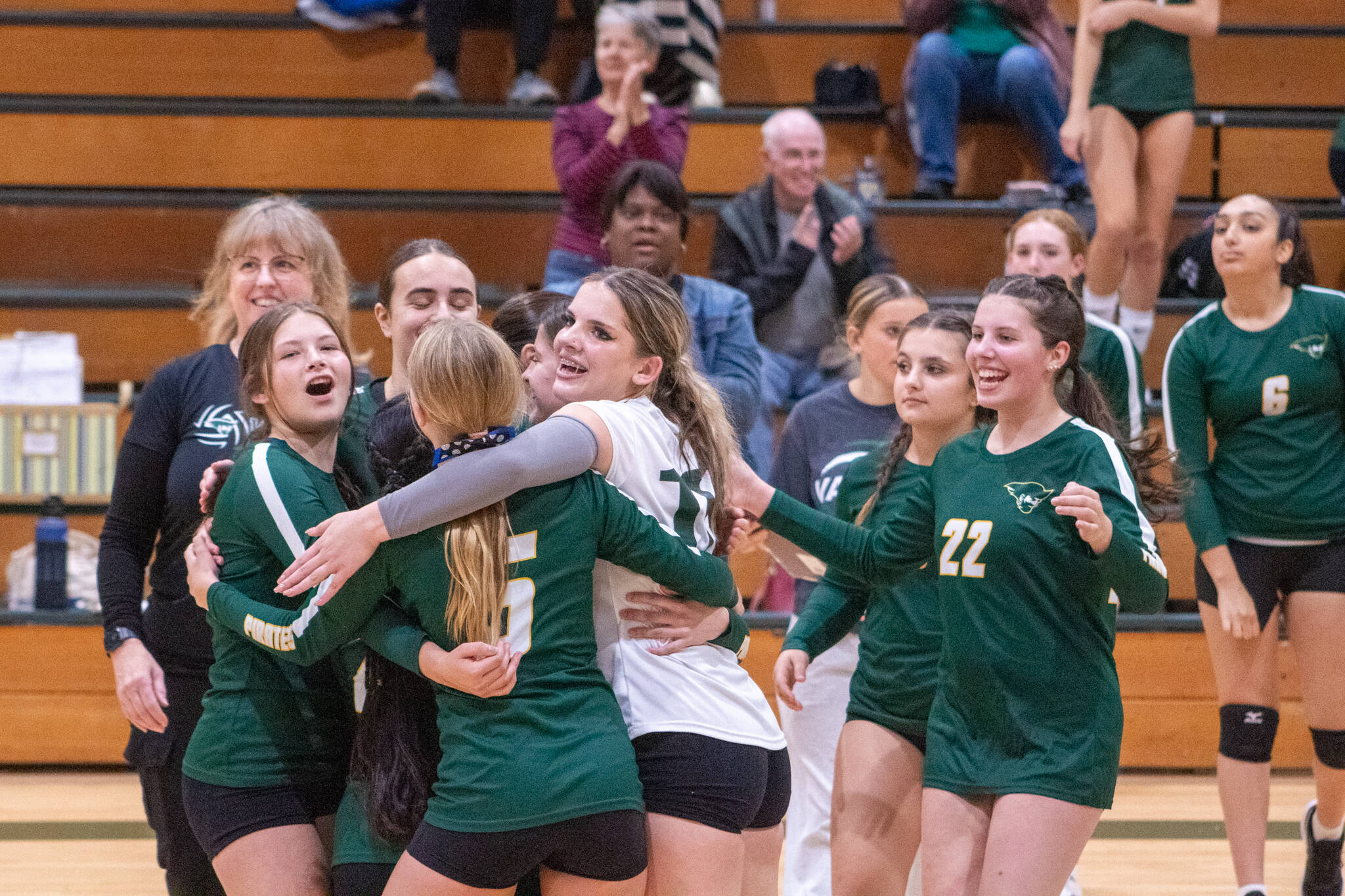 Alex Bruell photo Vashon’s volleyball players embrace after a rally in a game against East Jefferson High School at Vashon on September 25. (Alex Bruell photo)