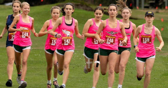 The girls of the Vashon High School Cross Country team kick off their race at Camas Prairie Golf Park in Port Townsend on Tuesday, September 17. (John Decker photo)