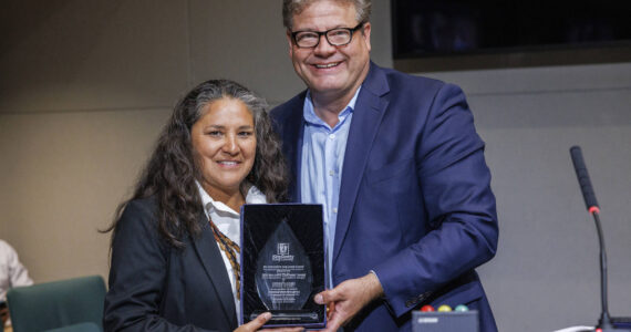 Esther Lucero (Diné), president and CEO of the Seattle Indian Health Board, is presented with the 2024 King County Recovery Champion Award on Sept 24. Councilmember Reagan Dunn presented the award. (Photo by Thomas Hawthorne, King County)