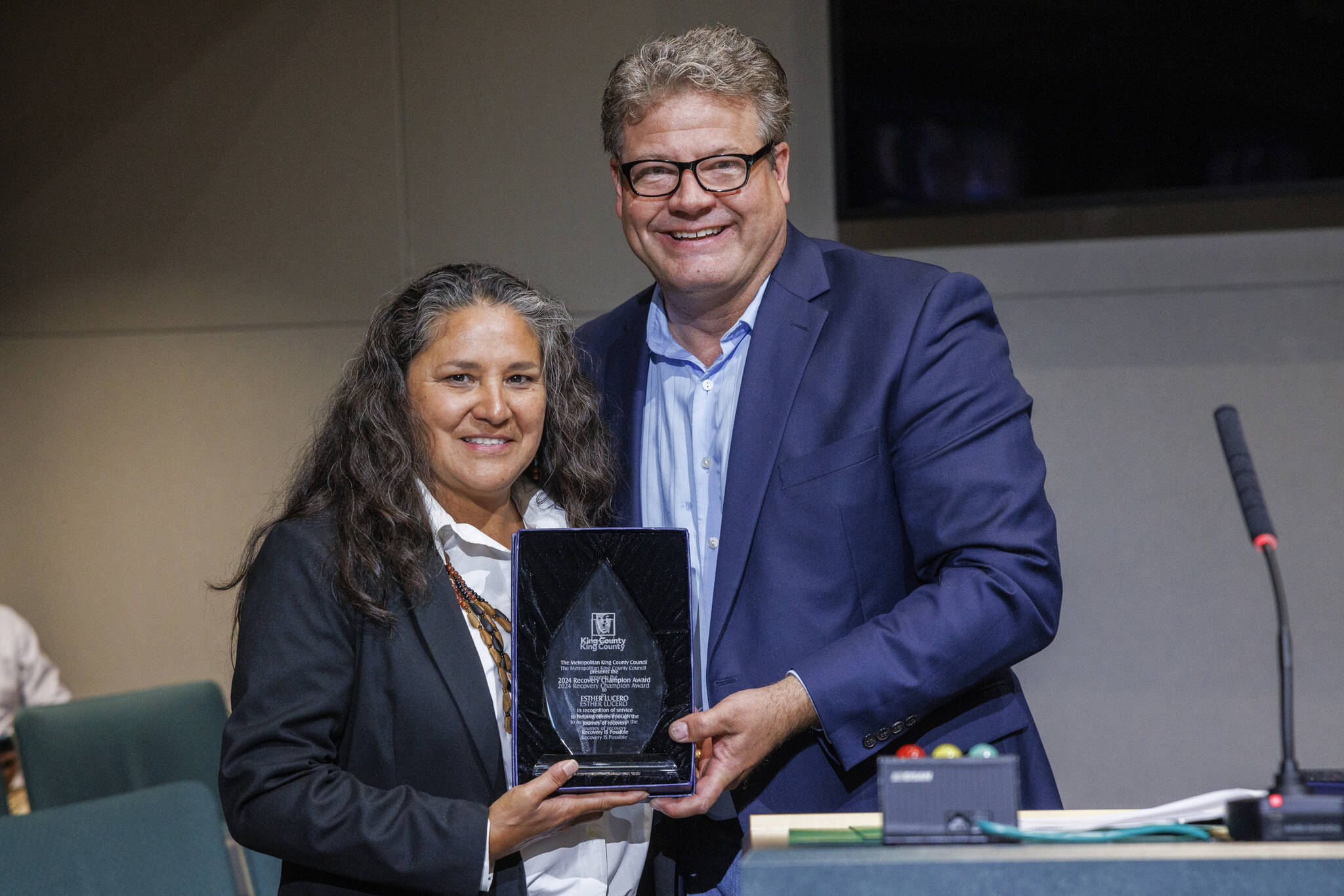 Photo by Thomas Hawthorne, King County.
Esther Lucero (Diné), President and CEO of the Seattle Indian Health Board, is presented with the 2024 King County Recovery Champion Award on Tuesday, Sept 24. Councilmember Reagan Dunn was on hand to present the award.