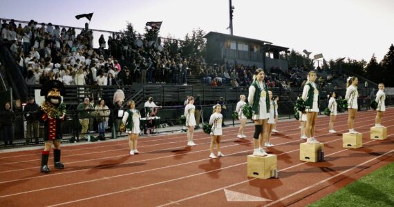 Aspen Anderson photo
The Vashon High School Cheer team pumps up the energy during the football team's home game against Sound Christian Academy on Friday, September 27.