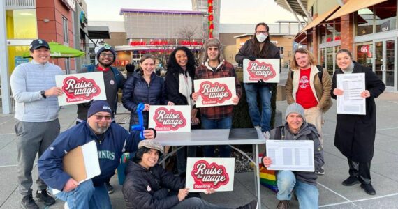 A group of volunteers from Raise the Wage Renton, shown gathering signatures in 2023. Renton residents approved a higher minimum wage for the city in a Feb. 2024 special election. (Photo courtesy of Raise the Wage Renton)