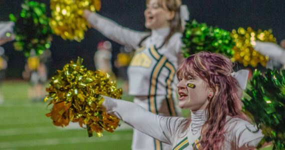 Alex Bruell photo
Cheerleaders pump up the crowd.