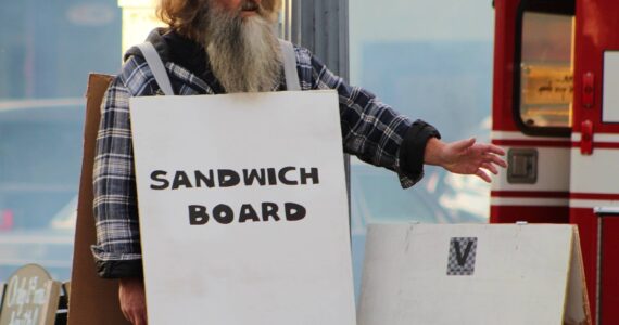 File photo
Halloween is coming, which means you’re soon sure to see creepy and clever costumes on Vashon Highway — such as this costume poking fun at the island’s proclivity for advertising events on sandwich boards.